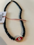 Collar negro con dije rojo